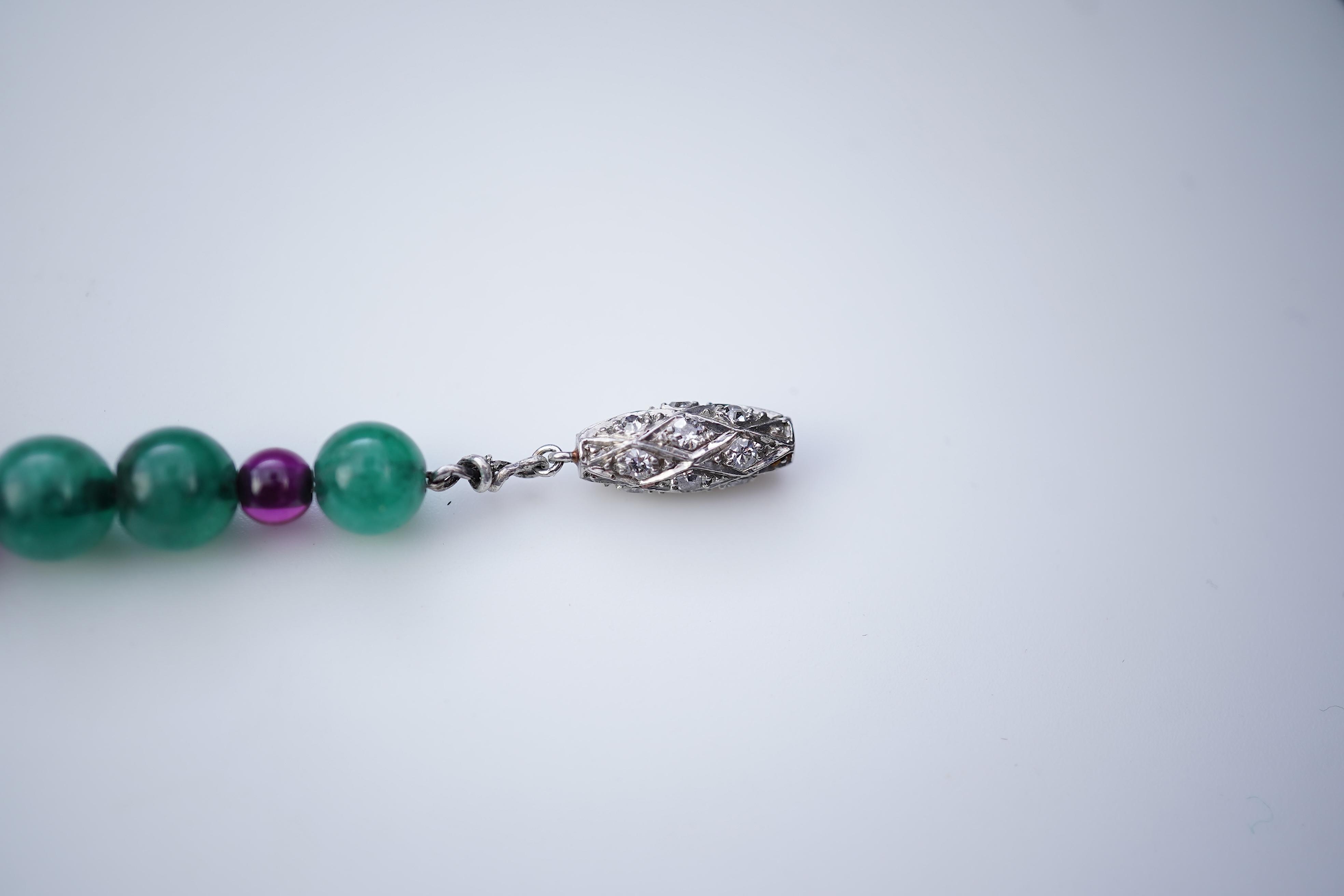 An Art Deco emerald, synthetic ruby and diamond bracelet, first half 20th century